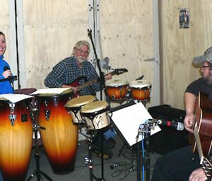 Three expeditioners practising for the band