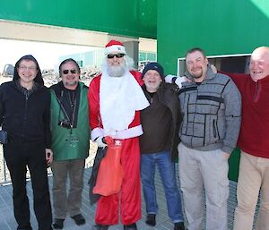 Five Russian expeditioners with Santa Clause
