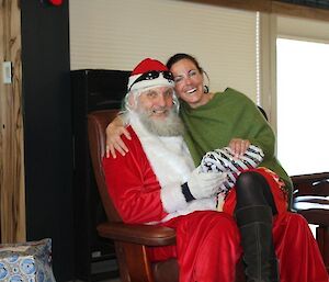 A female expeditioner sitting on Santa’s knee