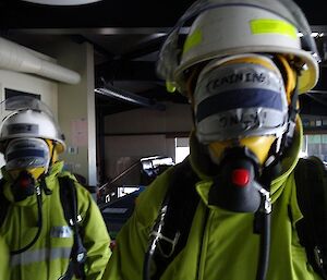 Expeditioners wearing breathing masks which have been blacked out