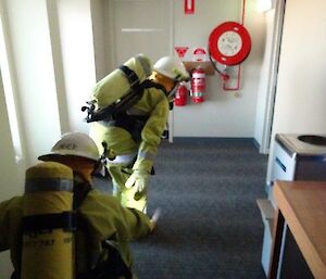 Expeditioners searching a building during a fire drill