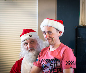 A expeditioner sitting on Santa’s knee