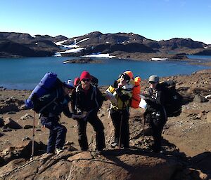 Four expeditioners trying to read a map