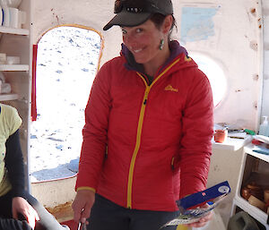 Expeditioner in a hut cooking