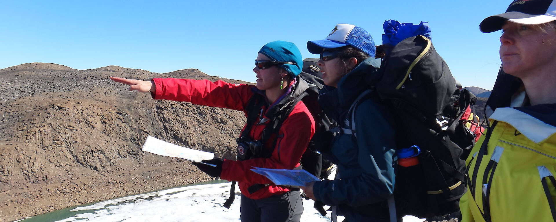 Expeditioners using maps