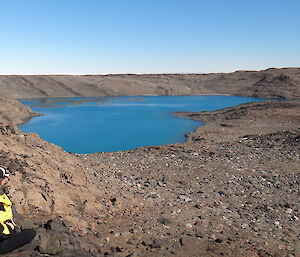 An expeditioner looking at a lake