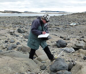 An expeditioner taking a survey in the field