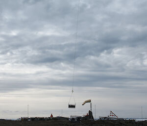 helicopter high in air with a sling load