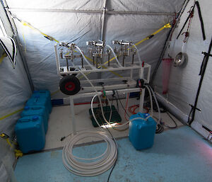 silver filtering rack inside a tent