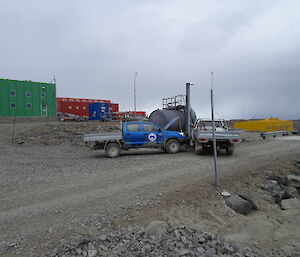 Two utes positioned to look like they have crashed into each other