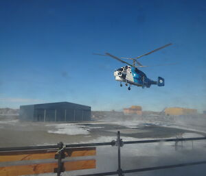 large helicopter coming landing on heli pad