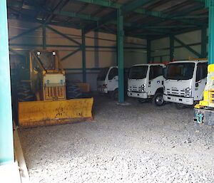 plant machinery parked in a large shed