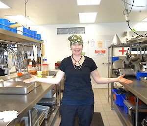 a very happy looking Chef in the kitchen