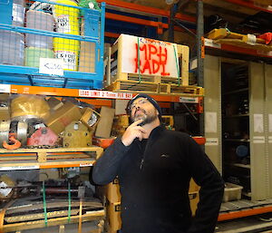 Expeditioner in the station warehouse searching for items
