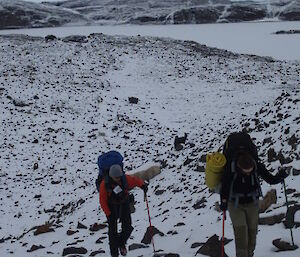 Two expeditioners hiking in the snow covered Vestfold Hills