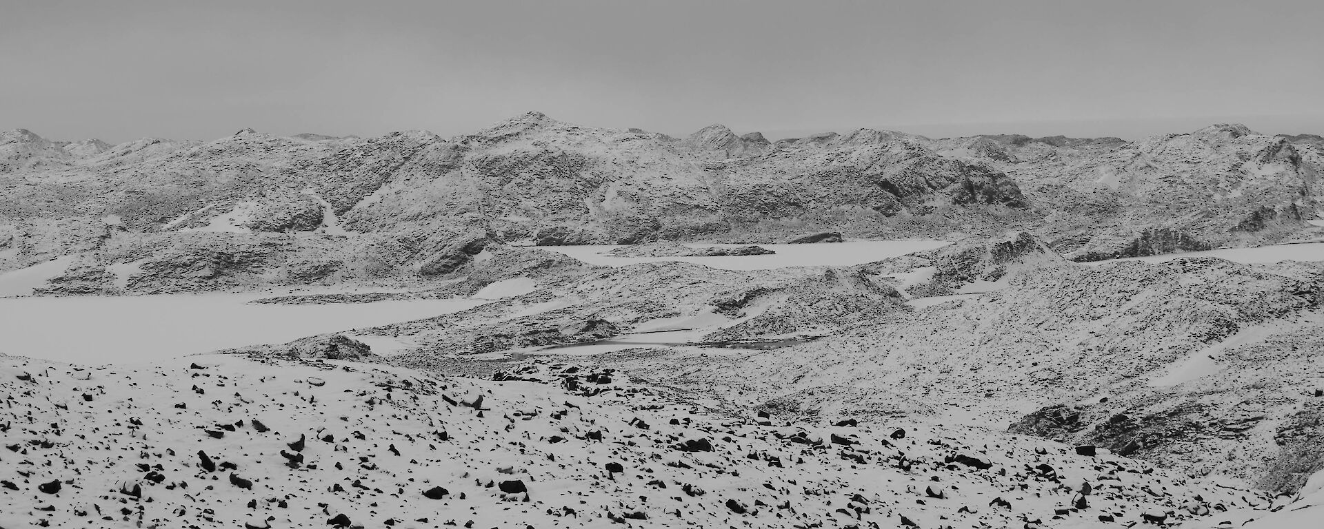 parorama photo of snow capped hills
