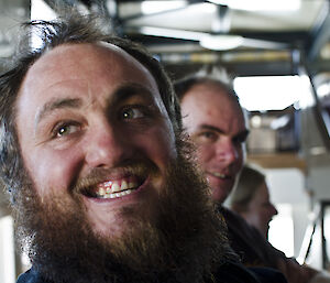close up photo of two expeditioners smiling
