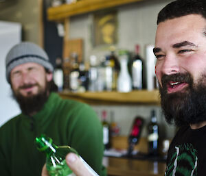 two expeditioners sharing in a good laugh