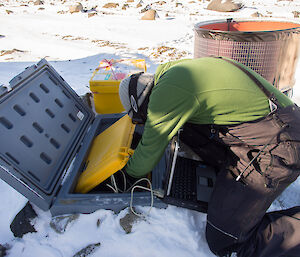 Expeditioner leaning over into a case