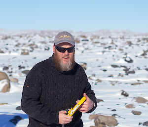 Close up photo of expeditioner with tape measure