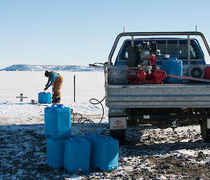 equipment loaded up in a ute water containers on the wharf