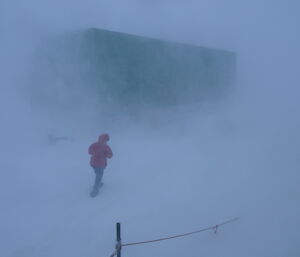 Expeditioner walking around station in low visibility