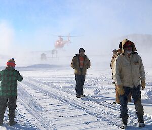 Helicopters land on the helipads