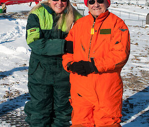 Expeditioners posing for photo near the heli pad