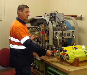 Expeditioner filling cylinders in the emergency vehcile shed