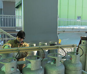 Expeditioner outside changing over gas cylinders