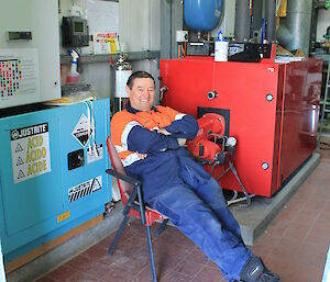 Expeditioner sitting relaxing in his workshop