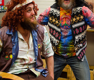 Two male expeditioners dressed in hippie clothes