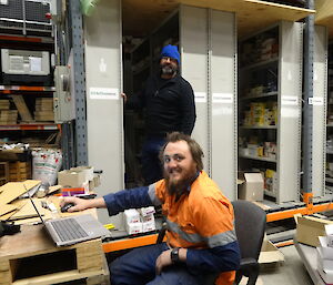 Two expeditioners sorting through stocks in the warehouse