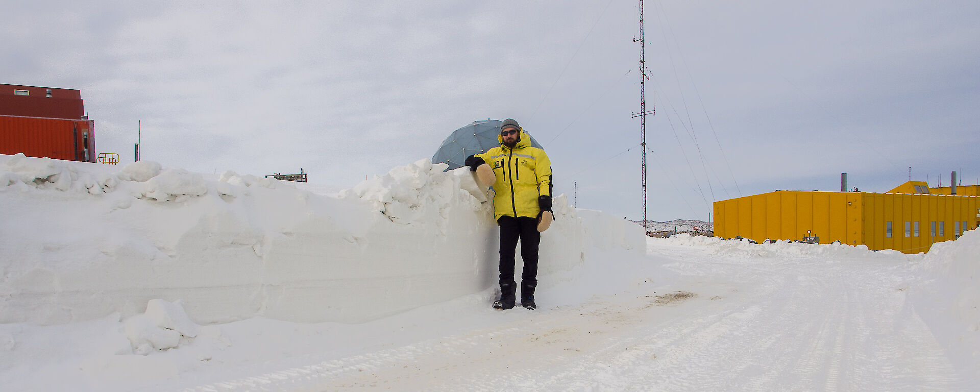 Expeditioner standing next to snow clearing