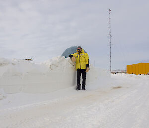 Expeditioner standing next to snow clearing