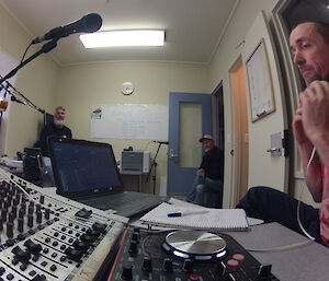 Four expeditioners in radio studio