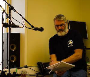 Expeditioner talking at a mic in the studio