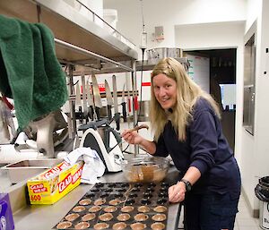 Expeditioner with a bowl of chocolate and egg moulds