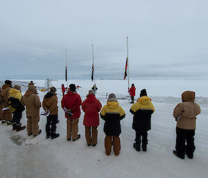 Expeditioner facing the flags