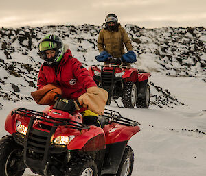 two expeditioners following on quads