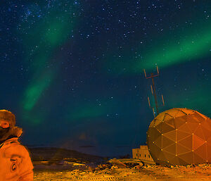 Expeditioner taking photo of aurora with self in photo