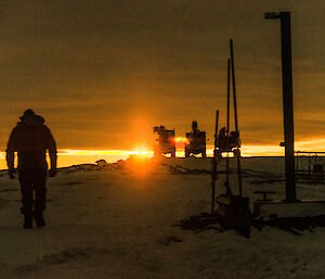 Expeditioner with bright sunset in the background