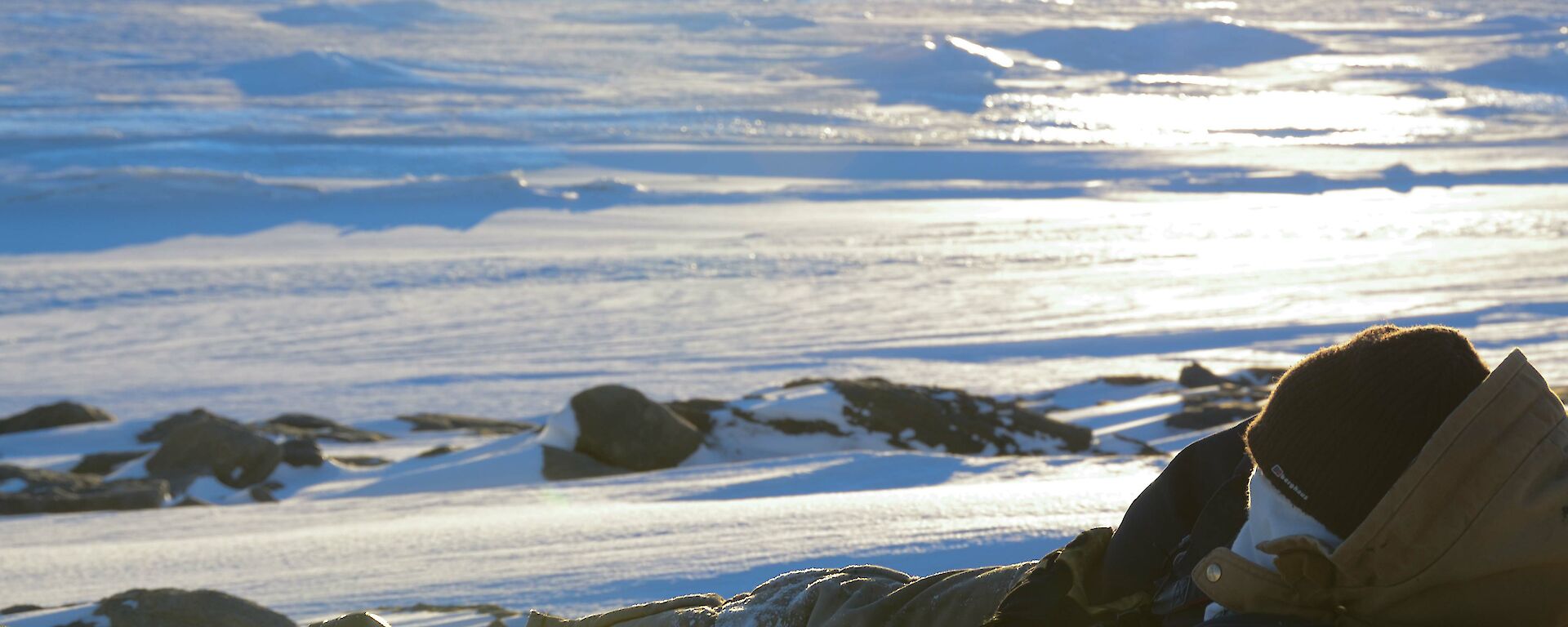 Scenic photo of snow and rock covered landscape
