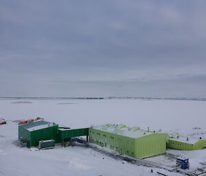 Aerial photo of two adjoining buildings snow covered ground