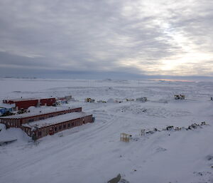 Aerial view of buildings, snow covered grounds