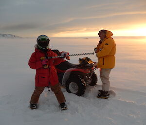 Expeditioner holding sea ice drill