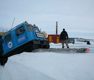 Hägglunds is pulled over the metre high embankment