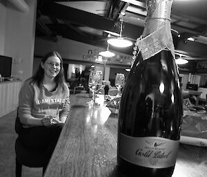 Expeditioner with a bottle of sparkling wine