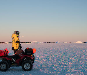 Expeditioner standing up on stationary quad