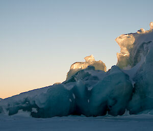 Close up photo of green blue iceberg